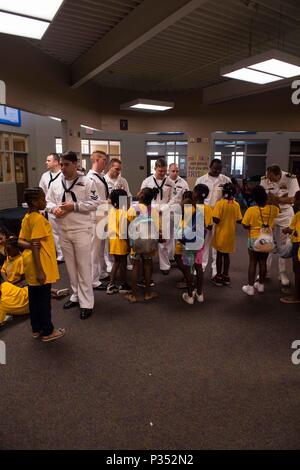 180615-N-SH284-1070 CHATTANOOGA, Tenn. (June 15, 2018) Members of the Ohio-class ballistic-missile submarine USS Tennessee (SSBN 734), interact with children at the Highland Park Boys and Girls Club during Chattanooga Navy Week. Navy Weeks are designed to connect the public with Navy Sailors, programs and equipment throughout the country. Every year, America's Navy comes home to approximately 15 cities across the country to show Americans why having a strong Navy is critical to the American way of life. (U.S. Navy photo by Mass Communication Specialist 2nd Class Vaughan Dill/Released) Stock Photo