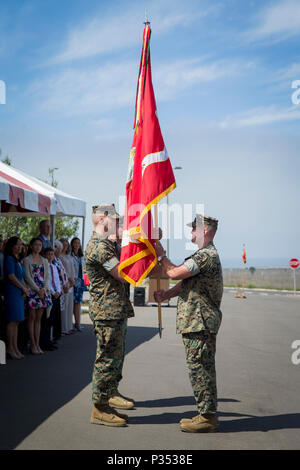 U.S. Marine Lt. Col. Richard Martin, left, outgoing commanding officer, 1st Marine Support Raider Battalion, U.S. Marine Corps Forces, Special Operations Command, receives the unit guidon from Sgt. Maj. Ryan Marzzarell, sergeant major, 1st MRSB, MARSOC, during a change of command ceremony at Marine Corps Base Camp Pendleton, California, June 15, 2018. The ceremony ensured that the unit and its Marines are never without leadership and also demonstrated an allegiance of Marines to their unit’s commander. (U.S. Marine Corps photo by Lance Cpl. Betzabeth Y. Galvan) Stock Photo