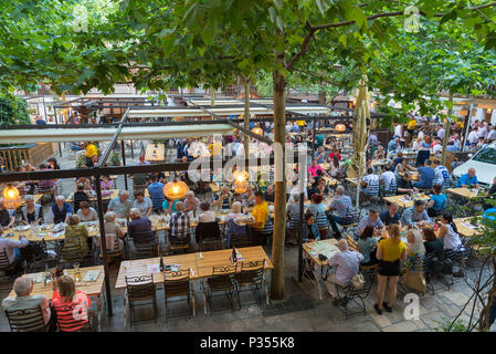 BUCHAREST, ROMANIA - JUNE 2, 2018:  Inner yard at Hanul lui Manuc (Manuc's Inn). a popular Romanian restaurant, Old city, Bucharest, Romania. Stock Photo