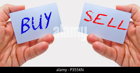 business man hands holding cards with buy sell words Stock Photo