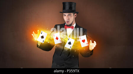 Illusionist in tails bandy play cards between his two hands Stock Photo ...
