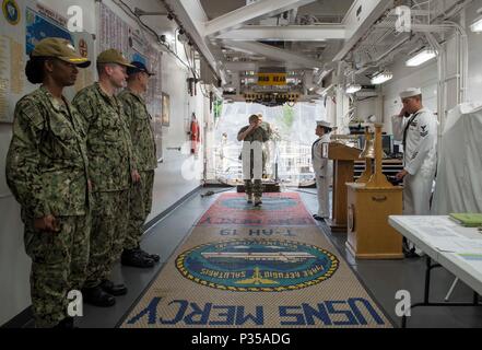 180614-N-MD713-0005  YOKOSUKA, Japan (June 14, 2018) Vice Adm. Phillip Sawyer, commander, U.S. 7th Fleet, crosses the quarterdeck aboard Military Sealift Command hospital ship USNS Mercy (T-AH 19), as part of a ship tour. Mercy is making port visits to Yokosuka and Tokyo to promote relationships between U.S. Navy Sailors and Japanese citizens through cultural exchange and bilateral training. (U.S. Navy photo by Mass Communication Specialist 3rd Class Cameron Pinske/Released) Stock Photo