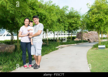 Young Asian Chinese family outdoor Stock Photo