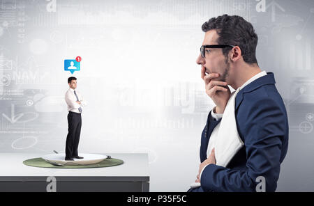 Giant businessman eating small man with financial background  Stock Photo