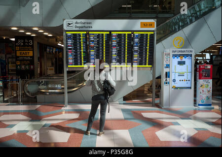 25.01.2017, Bangkok, Central Thailand, Thailand - A woman is looking at a scoreboard in the departure area of   Bangkok's Suvarnabhumi International A