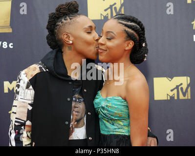 Lena Waithe, left, and her girlfriend, Alana Mayo attending the 2018 MTV Movie and TV Awards held at the Barker Hangar in Los Angeles, USA. Stock Photo