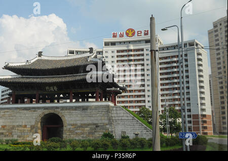 Pjoengjang, North Korea, the Pothong Gate in front of residential towers of the city Stock Photo