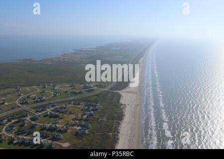 Aerial image of the Texas Gulf Coast, Galveston Island, USA. Haze due to warm weather conditions. Ocean, Gulf of Mexico, beach, real estate and travel Stock Photo