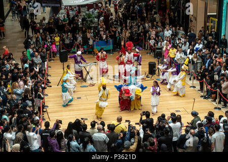 The Lions amd Cubs of Punjab, a Bhangra dancing troupe, perform an energetic routine  in Birmingham's Bullring Shopping Centre. Stock Photo