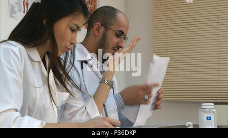 Young nurse and male doctor having an argument in the office Stock Photo