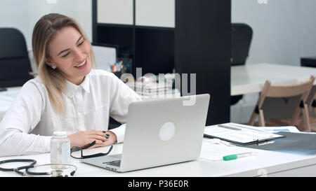 Businesswoman using laptop for video call Stock Photo