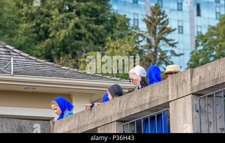 PENNSYLVANIA, USA-SEPTEMBER 9:Amish family watching a worldly performance in traditional clothing on sept. 4, 2008 in Lancaster. Amish people are proh Stock Photo