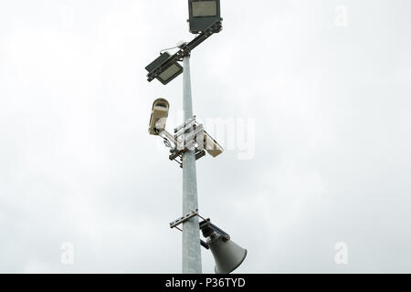 Security CCTV cameras and loudspeaker mounted on the post for street surveillance Stock Photo