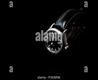 York, United Kingdom - 05/17/2018: A well-worn Sinn 556 I automatic watch, made in Germany. Isolated on a black background. Stock Photo