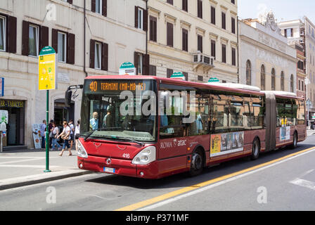 Atac, the red public bus in the street , Rome, Lazio, Italy Stock Photo