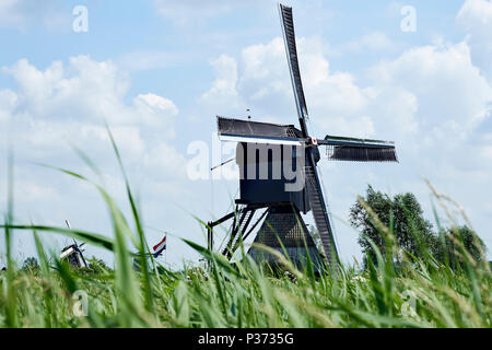 Kinderdijk in the province South Holland, Netherlands with windmills which have been used to drain the polder. Kinderdijk is UNESCO World heritage. Stock Photo