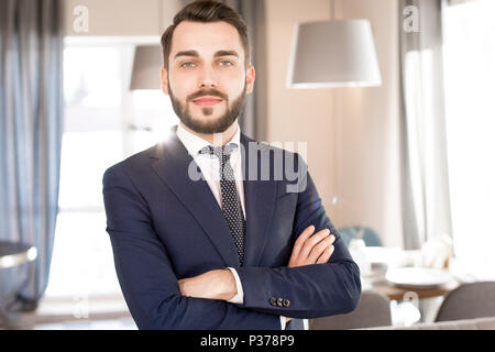 Content handsome bearded business manager Stock Photo