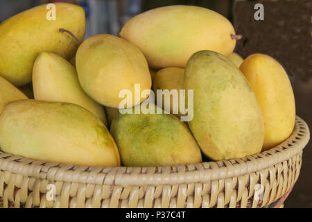 Yellow mangoes in a basket, Philippines Stock Photo