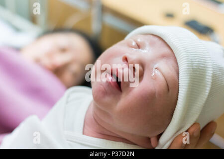 Mother giving birth to a baby. Female pregnant patient in a modern hospital. Stock Photo