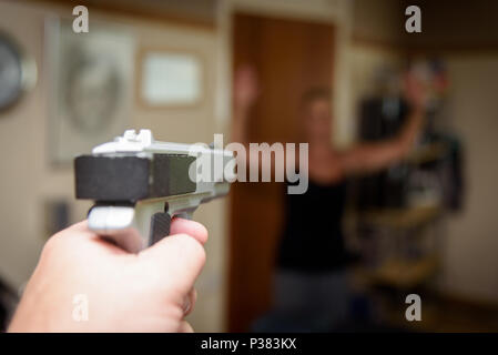 Woman Held At Gunpoint In Her Home By A Burglar Or Intruder Stock Photo ...