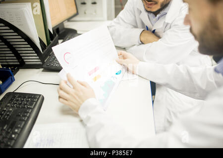 Engineers Analyzing Results of Accomplished Work Stock Photo