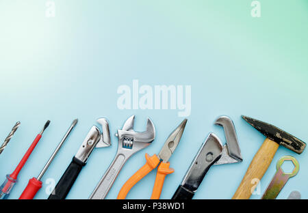Top view of Working tools, wrench, socket wrench, hammer, screwdriver, plier, electric drill, water balance on flat lay background. Fathers day Stock Photo