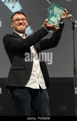 Singaporean director Yee Wei Chai receives the Grand Prix (George Lucas Award) for his film ''Benjamin's Last Day At Katong Swimming Complex'' during the Short Shorts Film Festival & Asia 2018 (SSFF) Award Ceremony at Jingu Kaikan on June 17, 2018, Tokyo, Japan. SSFF is one of Asia's largest short film festivals held in Tokyo from June 4 to 24. Credit: Rodrigo Reyes Marin/AFLO/Alamy Live News Stock Photo