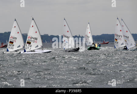 17 June 2018, Kiel, Germany: Sailers of the Laser Radial Class during a regatta of the Kieler Woche. The Kieler Woche is one of the largest sailing events in the world - more than 4000 athletes from 60 nations have applied to compete. Photo: Carsten Rehder/dpa Stock Photo
