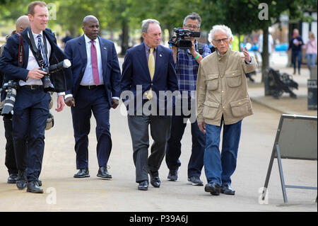 London, UK.  18 June 2018. Artist Christo (R) and Michael Bloomberg, Serpentine Galleries Chairman (3rd L) arrive at the official unveiling of The London Mastaba by Christo and Jeanne-Claude.  Comprising 7,506 horizontally-stacked coloured barrels, in hues of red, blue, mauve and white, secured on a floating platform, it is Christo's first public outdoor work in the UK.  The geometric form takes inspiration from ancient mastabas from Mesopotamia and will be on display 18 June to 21 September 2018.  Credit: Stephen Chung / Alamy Live News Stock Photo