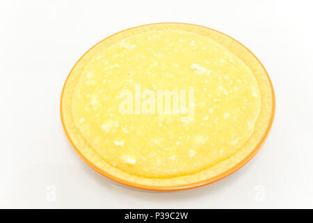 Polenta with Cheese in a Plate Isolated on White. Stock Photo