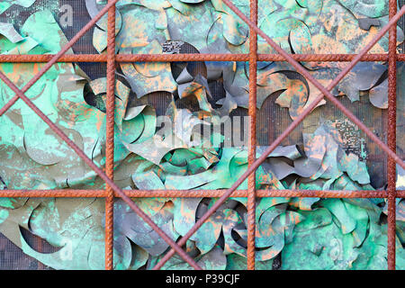 background of boarded up window  with iron bars and colored paper Stock Photo