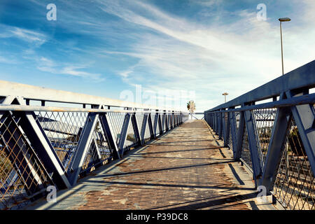 modern metal overpass bridgeover the road  to the blue sky Stock Photo