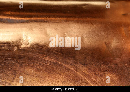 Scratched texture copper plating background close-up Stock Photo