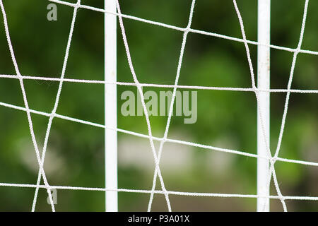 Steel grating fence of soccer field, Metal fence with blur background. Stock Photo