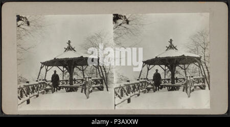 . Man standing at Summer House in snow storm. Alternate Title: Central Park, New York, Mar. 1916.  Created: March 1916.  Coverage: 1915-1919. Source Imprint: 1915-1919.. Digital item published 2-16-2006; updated 4-23-2009. 183 Man standing at Summer House in snow storm, from Robert N. Dennis collection of stereoscopic views Stock Photo