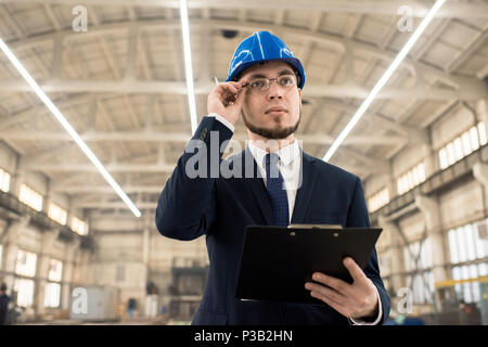 Construction inspector examining building structure Stock Photo