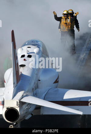 OCEAN (December 10, 2008) Aviation Boatswain's Mate (Handling) 2nd Class Leatrice Koenig guides a T-45 Goshawk assigned to Carrier Training Wing (CTW) 1 onto the No. 1 steam-powered catapult to be launched from the flight deck of the Nimitz-class aircraft carrier USS Abraham Lincoln (CVN 72). Lincoln is conducting training and carrier qualifications. Stock Photo