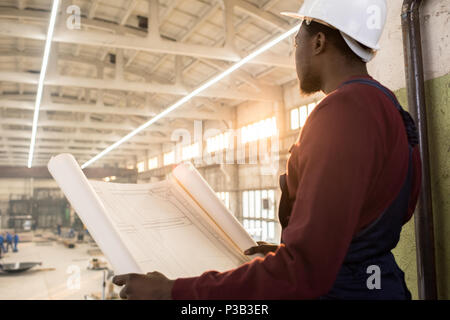 Pensive construction manager controlling building process Stock Photo