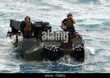 AT SEA (July 7, 2009) Marines assigned to the 31st Marine Expeditionary Unit direct an amphibious assault vehicle to the welldeck of  the forward-deployed amphibious transport dock USS Denver (LPD 9) during a Talisman Saber 2009 (TS09) training exercise July 7, 2009. TS09 is a biennial combined training activity designed to train Australian and U.S. forces in planning and conducting combined task force operations, which will help improve ADF/US combat readiness and inter-operability. Stock Photo