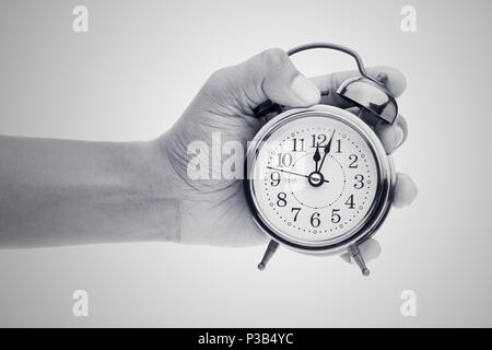 Man hands holding big round clock, isolated on white Stock Photo