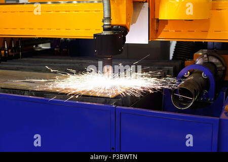 Metal cutting with a CNC table plasma cutting machine. Stock Photo