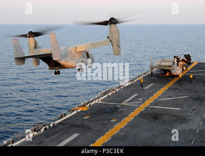 A U.S. Marine Corps MV-22B Osprey aircraft from Marine Medium Tiltrotor Squadron (VMM) 263, 22nd Marine Expeditionary Unit (MEU) takes off from amphibious assault ship USS Bataan (LHD 5) Nov. 6, 2009, in the Indian Ocean. Ospreys are being flown to Camp Bastion, Afghanistan, where they will be transferred to VMM-261 and used to support the 2nd Marine Expeditionary Brigade. This is the first time the aircraft will be used in Afghanistan. The 22nd MEU is serving as the theater reserve force for U.S. Central Command. Stock Photo