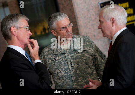 (from left) Secretary of the Army John M. McHugh, Chief of Staff of the Army Gen. George W. Casey Jr., and Secretary of Defense Robert M. Gates have a conversation before participating in a memorial service Nov. 10, 2009, at Fort Hood, Texas. The ceremony is to honor the victims of the Nov. 5 shooting rampage that left 13 dead and 38 wounded. (DoD Stock Photo