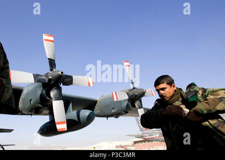 KABUL (Nov. 19, 2009) Graduates from Afghan National Army accelerated combat company training program depart Kabul International Airport in route to Camp Bastion in the Helmand Province where they will reinforce troops of the ANA 205th battalion.  Accelerated companies are part of the goal of a 134,000 soldier army by October of 2010. The companies play an integral role in the increased capability of the Afghanistan National Army.   091119 Stock Photo