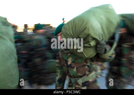 KABUL (Nov. 19, 2009) Graduates from Afghan National Army accelerated combat company training program arrive at Kabul international airport to be transported to Camp Bastion in the Helmand province where they will reinforce troops of the ANA 205th battalion. Accelerated companies are part of the goal of a 134,000 soldier army by October of 2010. The companies play an integral role in the increased capability of the Afghanistan National Army. 091119 Stock Photo