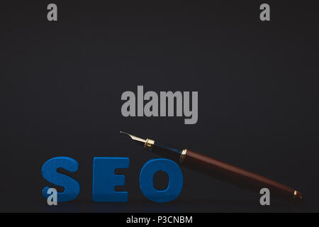 SEO text alphabet for Search Engine Optimization concept and pen, business SEO. Stock Photo