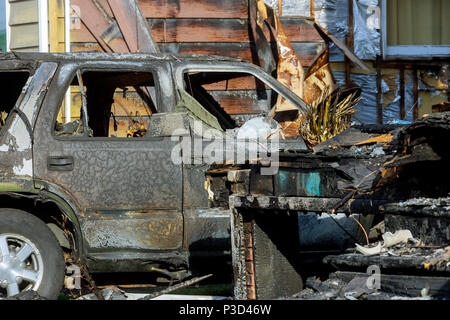 Burned car. set fire to cars in parking lot. Bandit wars, the destruction of the fire machine after the Deformed fire machine. Consequences of car acc Stock Photo