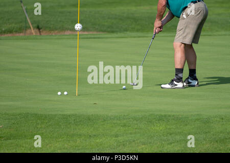 Golfer on the green, mature male, not recognizable, copyspace Stock Photo