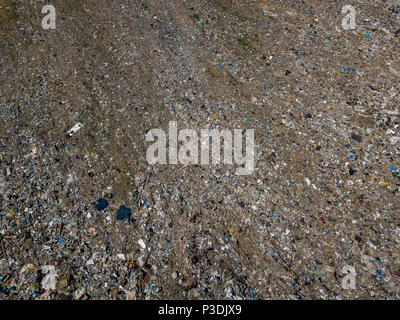 Environmental pollution. Aerial top view photo from flying drone of large garbage pile. Garbage pile in trash dump or landfill. Stock Photo