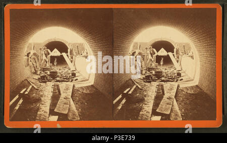 290 Sudbury River Conduit, B.W.W., div. 4, sec. 15, Nov. 13, 1876. View from inside of conduit; brickmasons at work in the east terminal chamber of bridge, from Robert N. Dennis collection of stereoscopic views Stock Photo